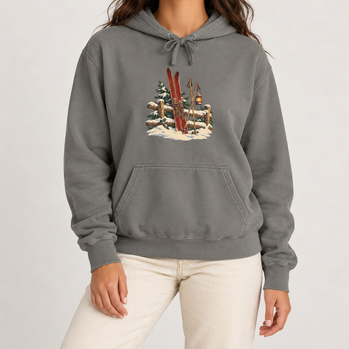 Vintage Ski Lodge hoodie in Grey worn, front view with the small skis-and-fence print