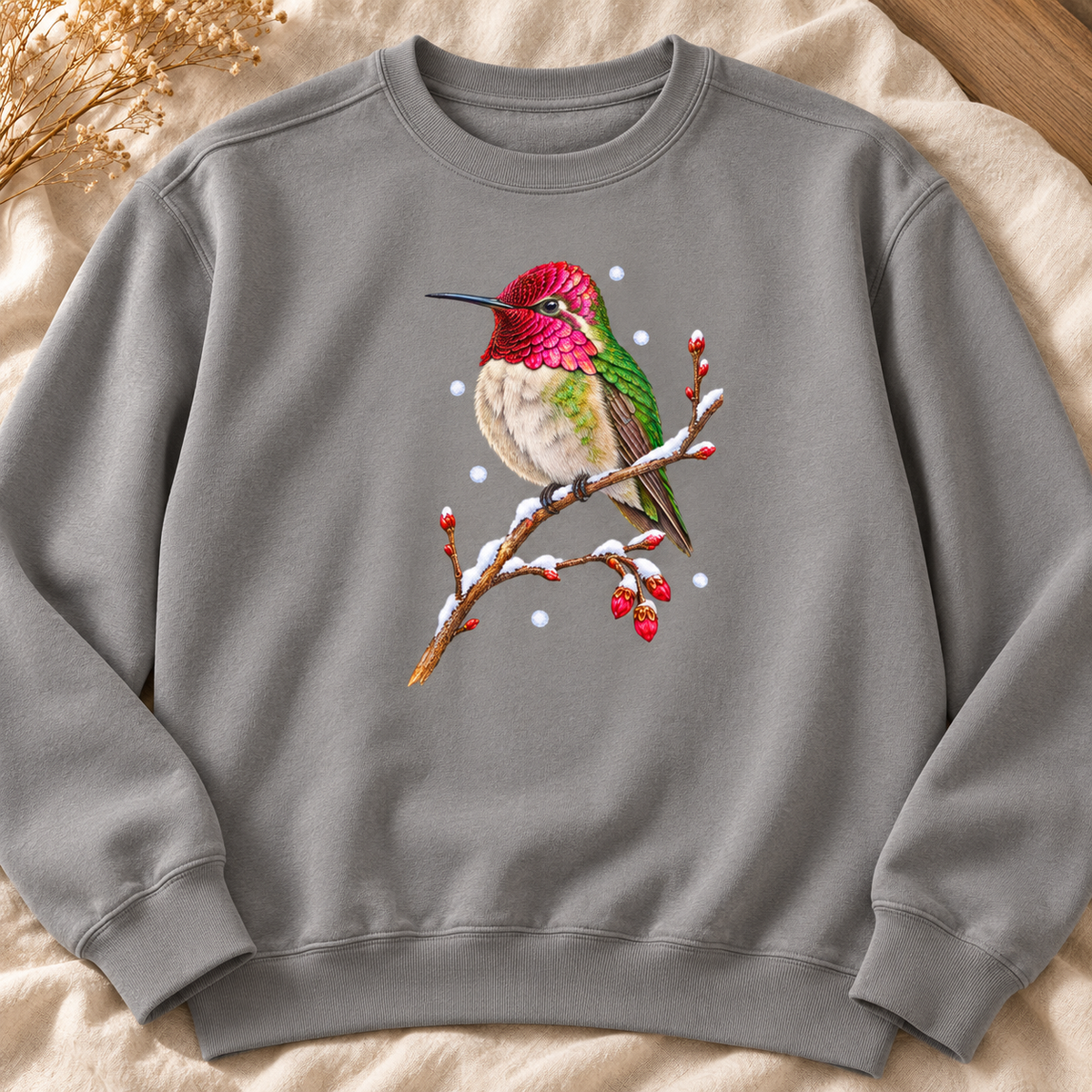 Winter Hummingbird Sweatshirt in Grey - a watercolor Anna's hummingbird with a magenta head perched on a snowy twig, printed on a garment-dyed Comfort Colors 1566 crewneck