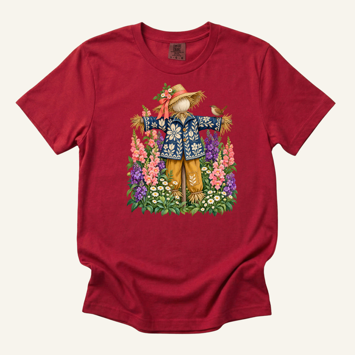 He Let Them Stay T-Shirt in Red — a bold contrast against the blue jacket, runs S to 3XL