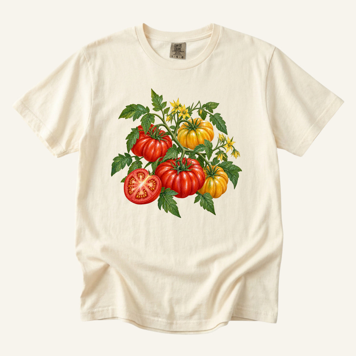 Heirloom Tomato T-Shirt in Ivory — red and golden heirloom tomatoes with leafy stems, yellow blossoms and one sliced open