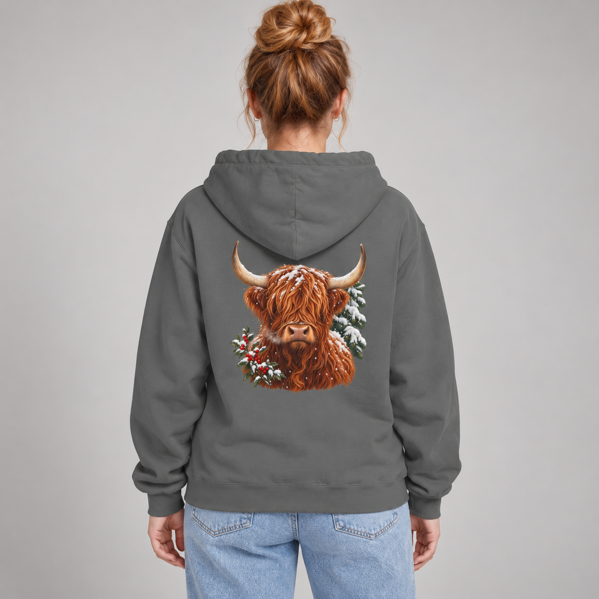Winter Highland Cow hoodie worn with the hood down