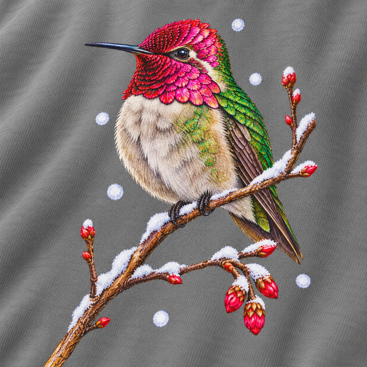 Close-up of the winter hummingbird print on a Grey Comfort Colors crewneck - magenta crown and throat, emerald back, snowy twig and seed heads