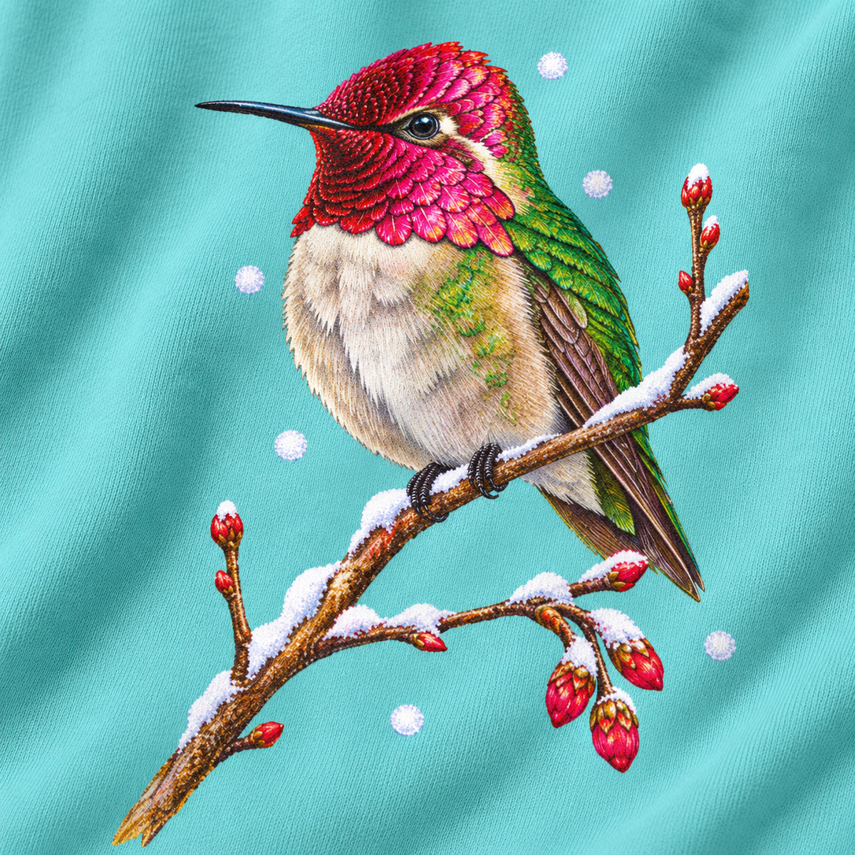 Close-up of the winter hummingbird print on a Chalky Mint Comfort Colors crewneck - magenta crown and throat, emerald back, snowy twig and seed heads