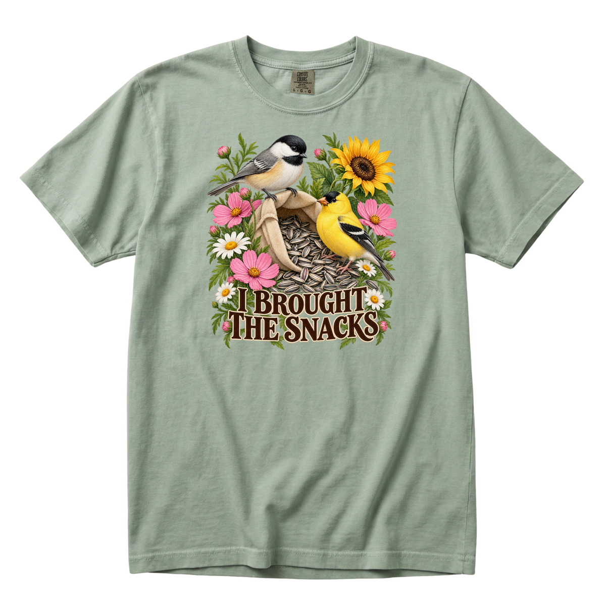 I Brought the Snacks tee in Bay, a chickadee and goldfinch garden print on sage green