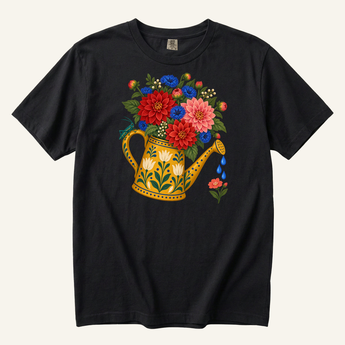It Started With One Pot T-Shirt in Black — the golden can, white decorative flowers and blue droplets at strong contrast