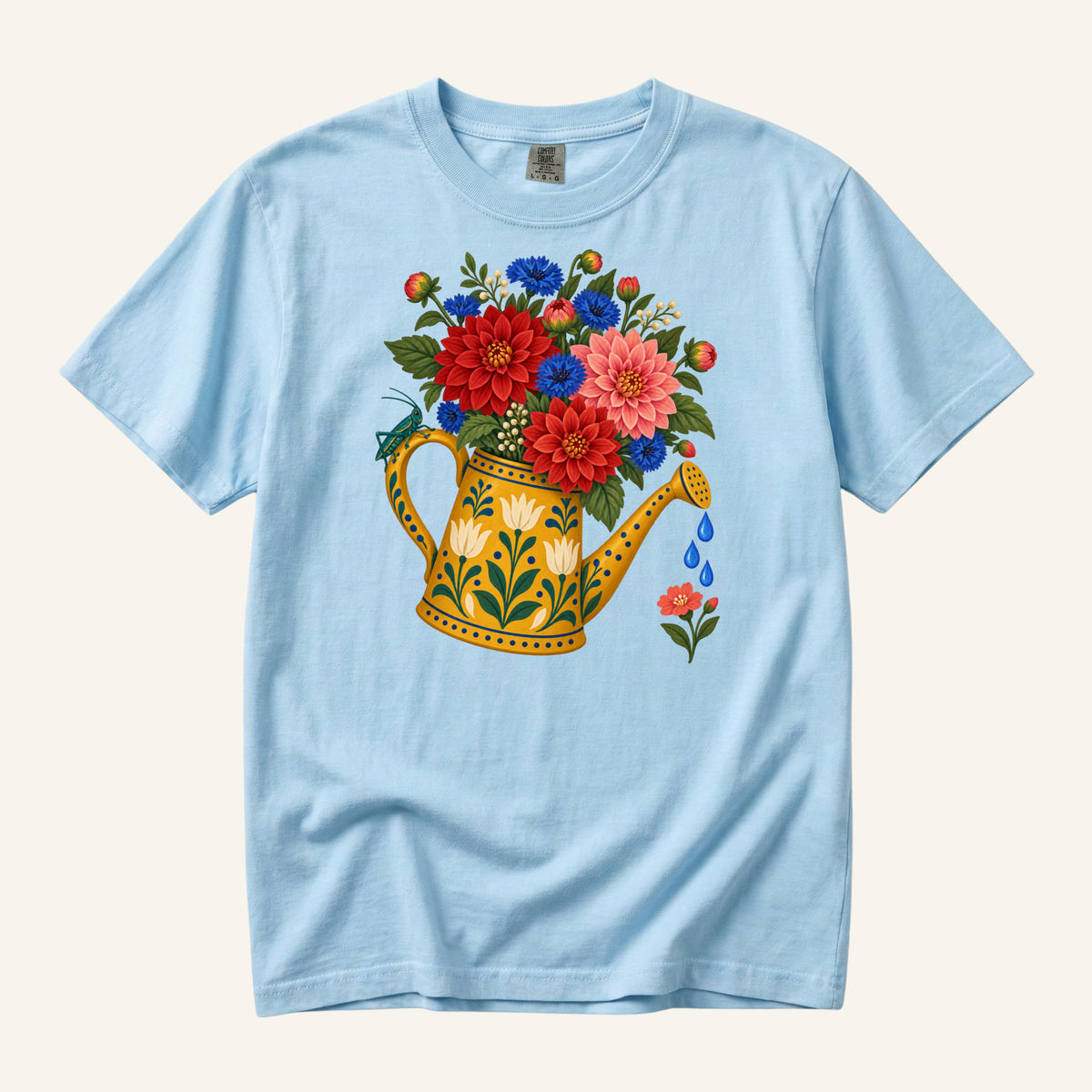 It Started With One Pot T-Shirt in Chambray — a cooler backdrop that sets the golden can apart and echoes the blue flowers
