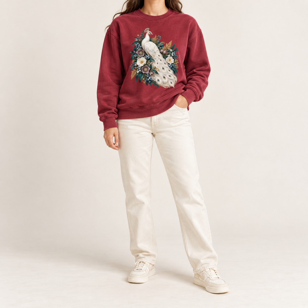 Ivory peacock floral sweatshirt, relaxed unisex fit, adult sizes S to 3XL — an ivory peacock with a long curving tail among cream and purple flowers and deep green leaves
