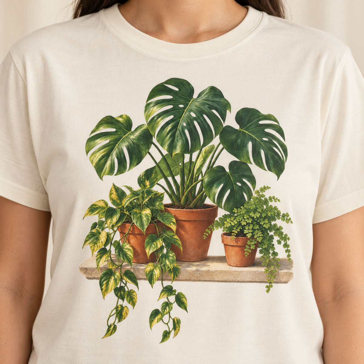 Houseplant t-shirt in White – flat view of the monstera, pothos and fern in terracotta pots on a garment-dyed Comfort Colors tee