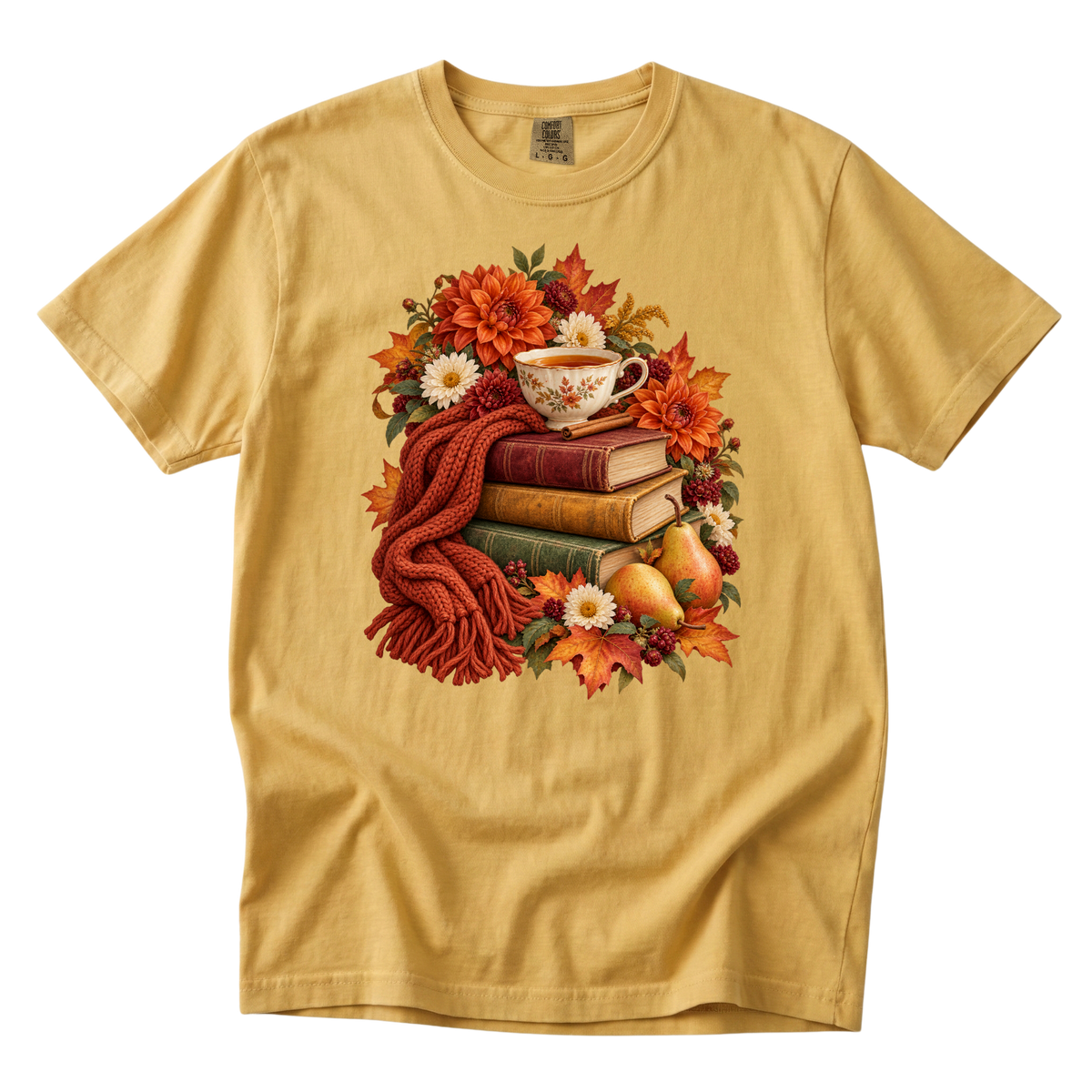 Just One More Chapter tee in Mustard, a teacup on a stack of books with autumn flowers and pears
