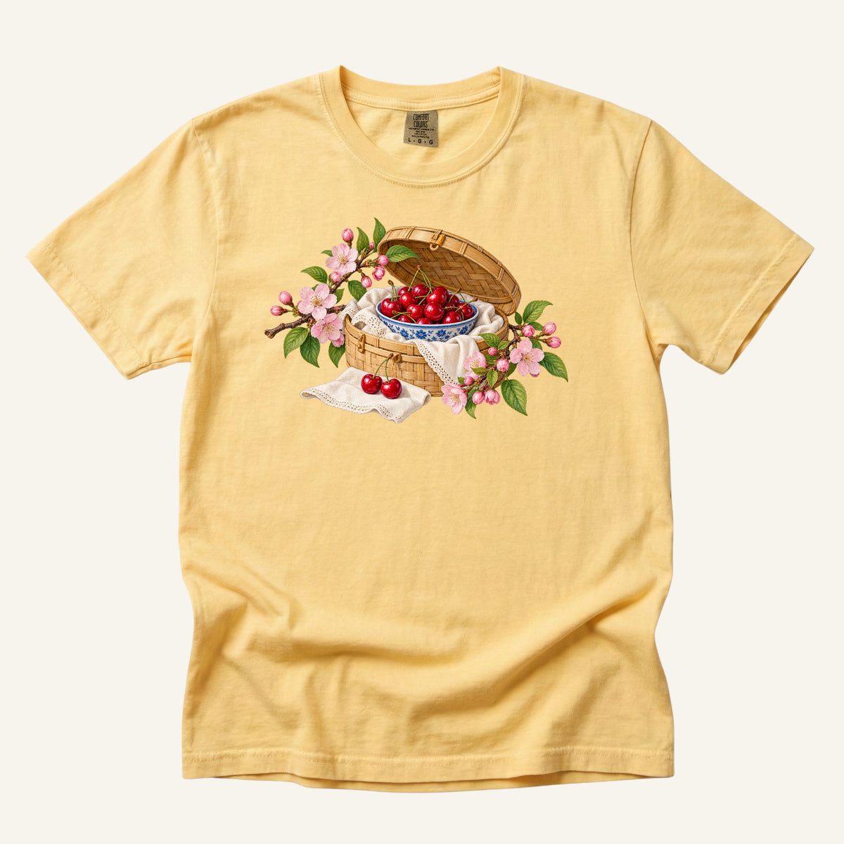 Leave the Afternoon Open tee in Butter, a cherry picnic and blossom print on soft yellow