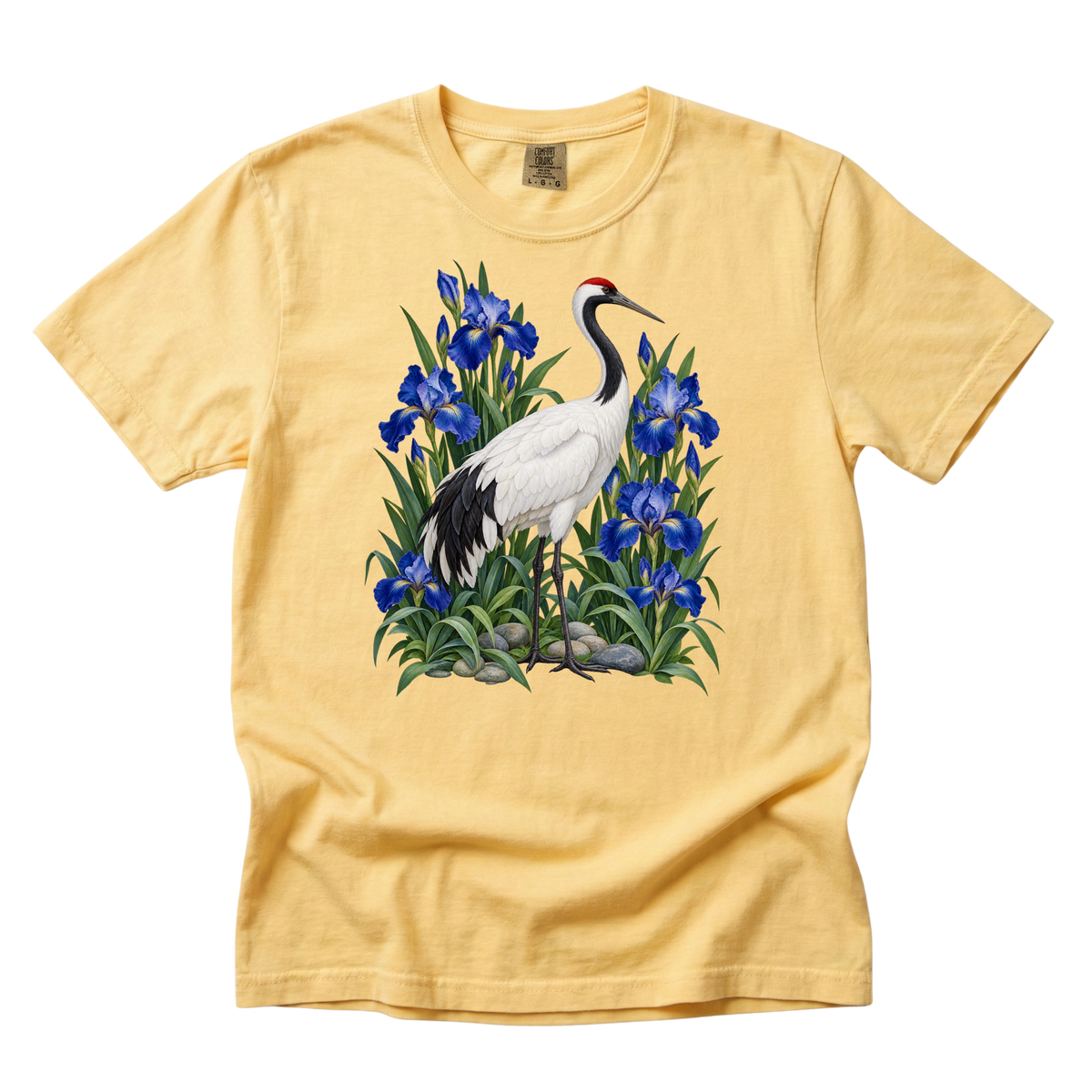 Let the Water Settle tee in Butter, a red-crowned crane with blue irises and stones