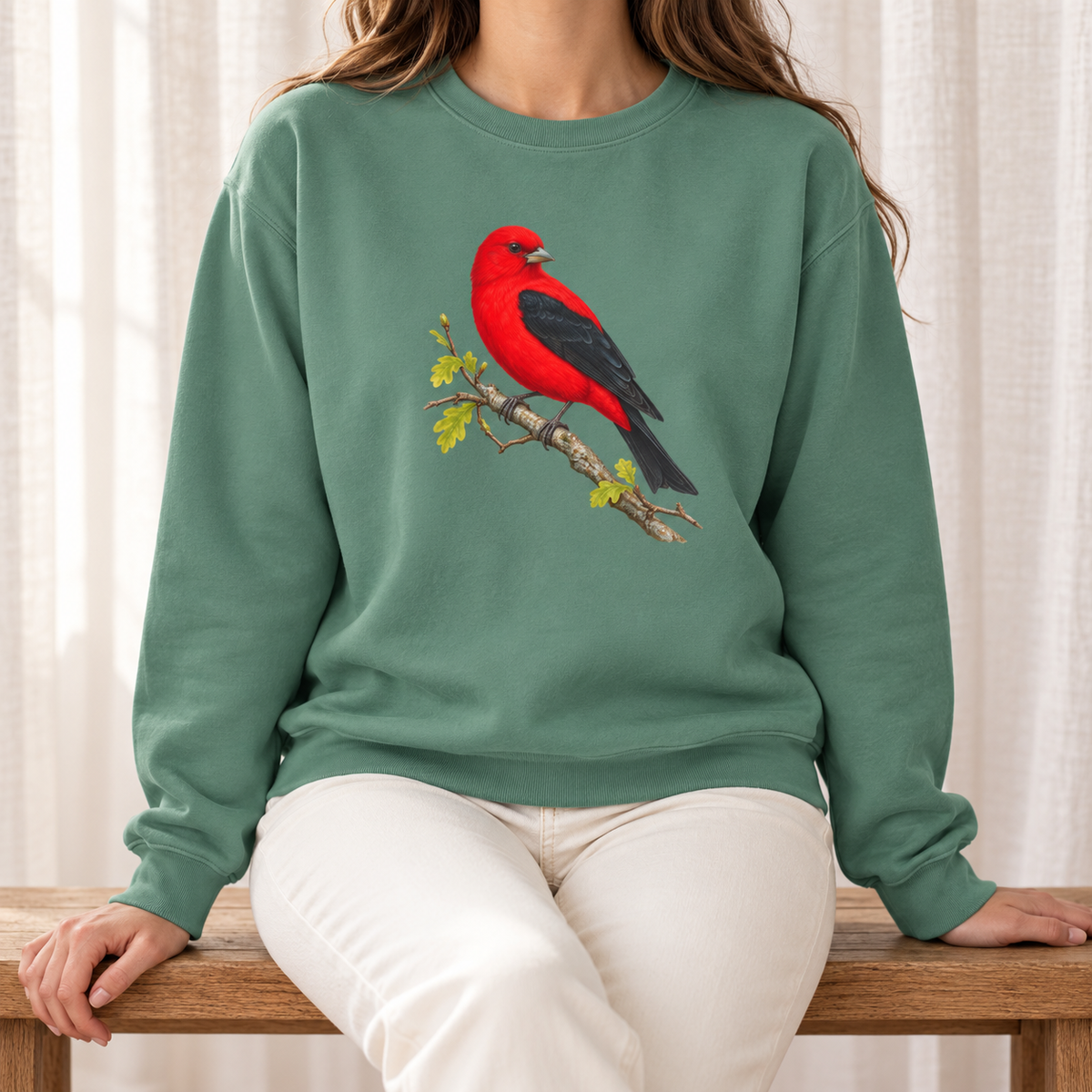 Scarlet Tanager sweatshirt in Light Green — red bird with black wings on a spring oak branch, garment-dyed Comfort Colors crewneck