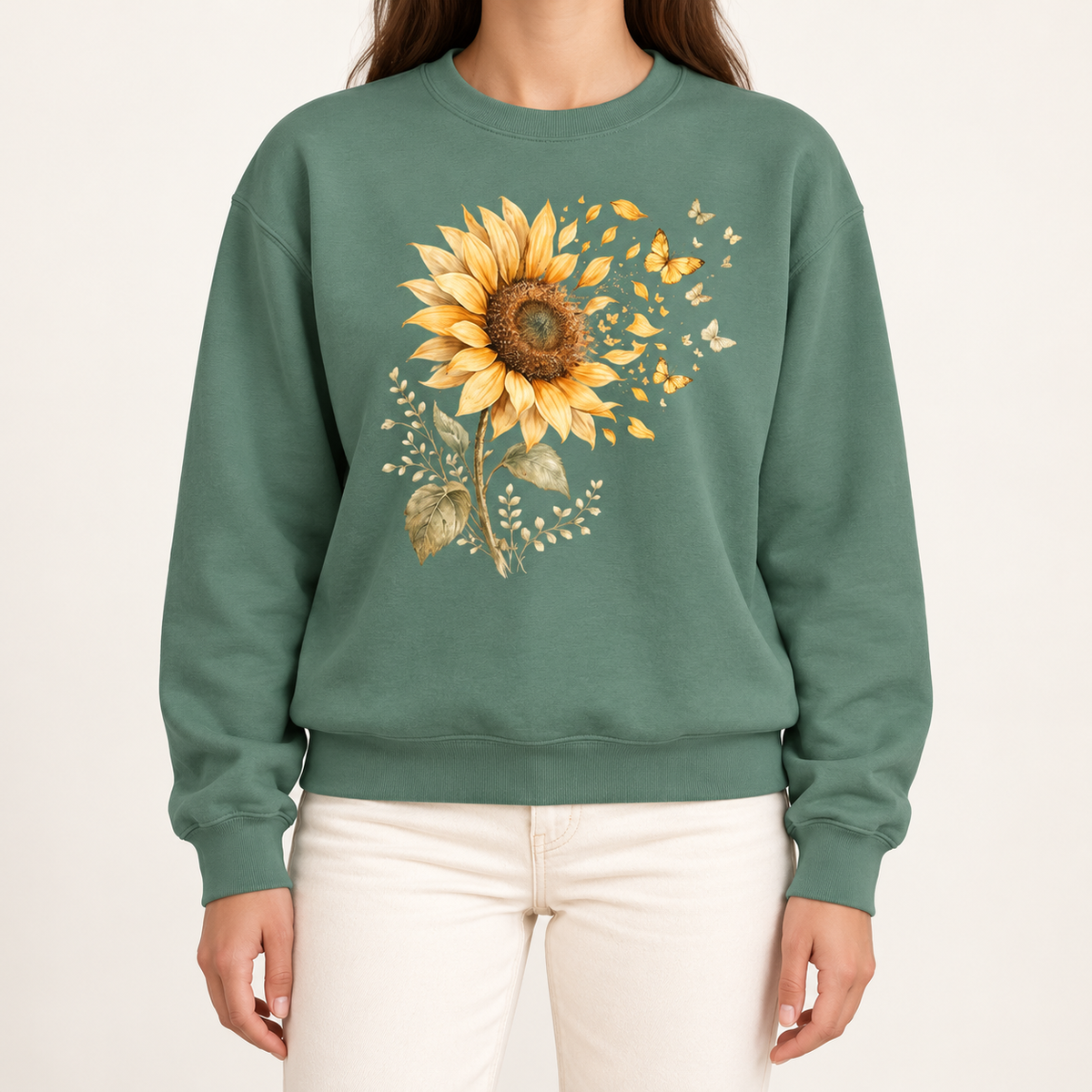 Sunflower butterfly sweatshirt in Light Green – a golden watercolor sunflower letting go of its petals as small gold butterflies, printed large on the chest of a Comfort Colors crewneck