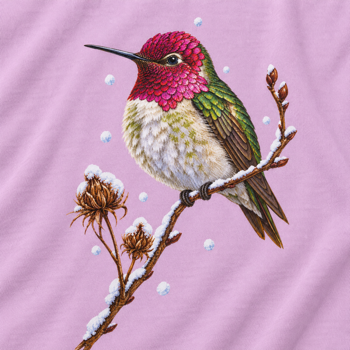 Close-up of the winter hummingbird print on a Orchid Comfort Colors cotton tee - magenta crown and throat, emerald back, snowy twig and seed heads