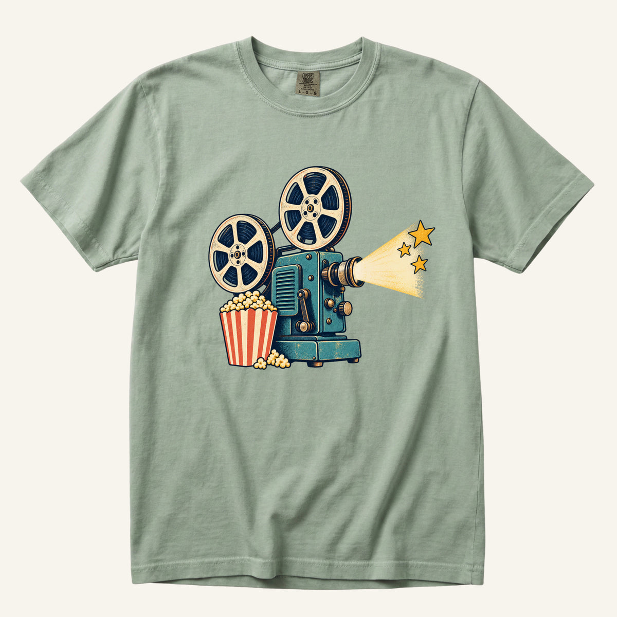 Meet Me at the Movies T-Shirt in Bay — soft sage complementing the teal projector