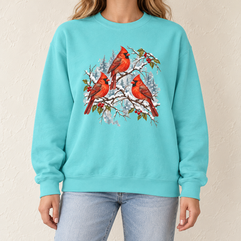 Three Snowy Cardinals on Berry Branches Sweatshirt in Chalky Mint - three red cardinals on snow-covered winterberry branches, printed on a garment-dyed Comfort Colors 1566 crewneck