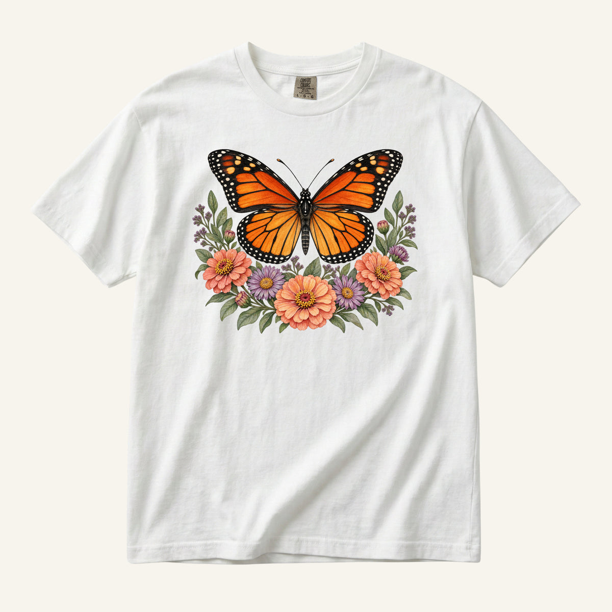 Monarch & Wildflowers T-Shirt in White — a monarch butterfly among garden flowers on garment-dyed cotton