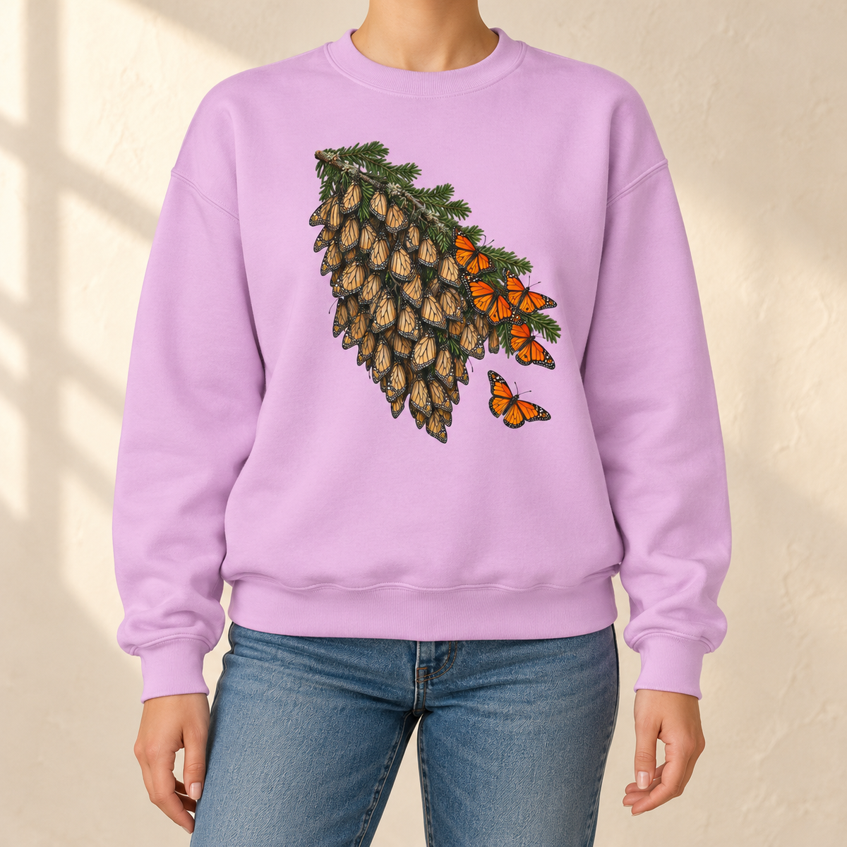Overwintering Monarchs Sweatshirt in Orchid - a watercolor roost of monarch butterflies on a fir bough, wings closed, a few open in the sun, printed on a garment-dyed Comfort Colors 1566 crewneck