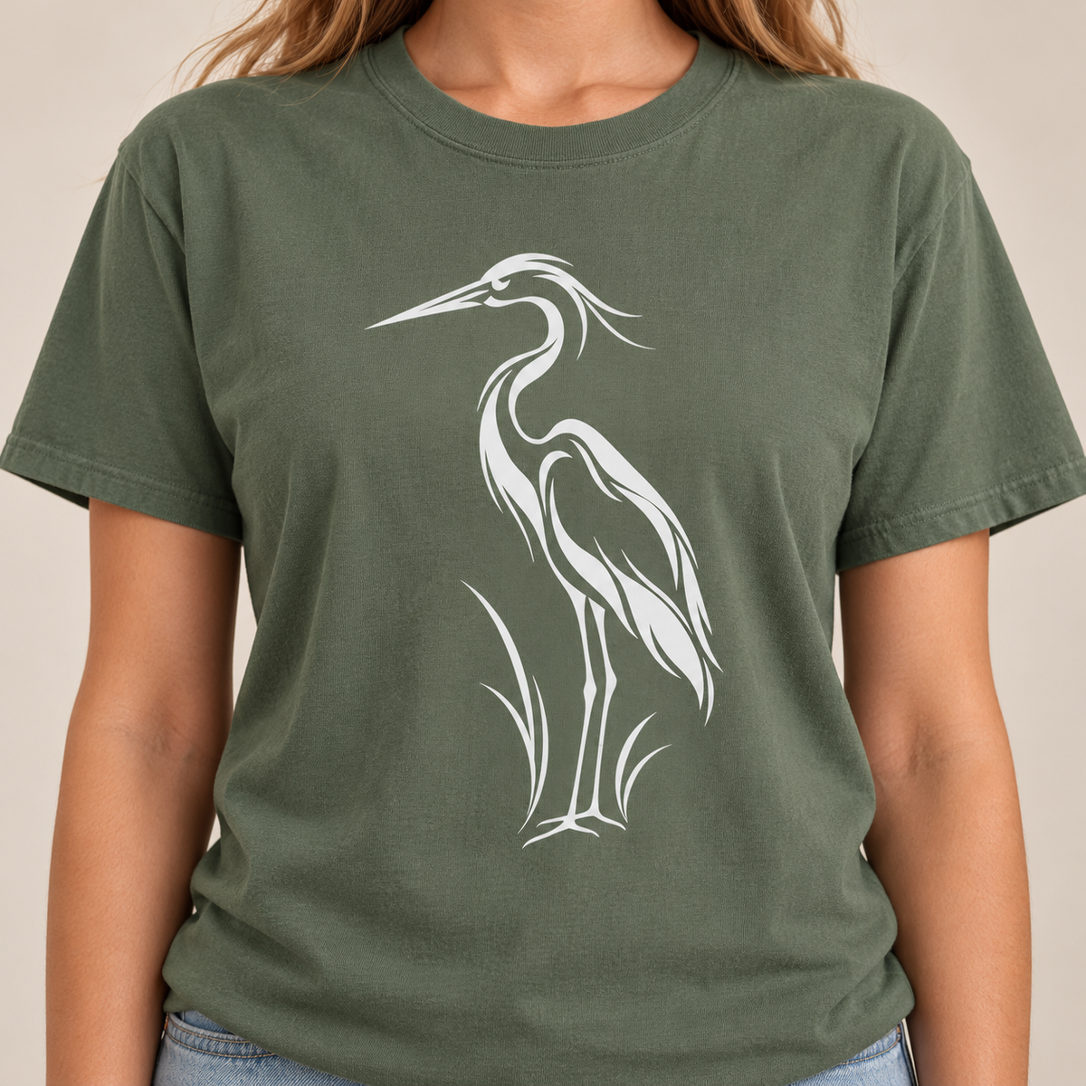 Flowing Great Blue Heron T-Shirt in Moss, second view — white line-art heron on a garment-dyed Comfort Colors tee