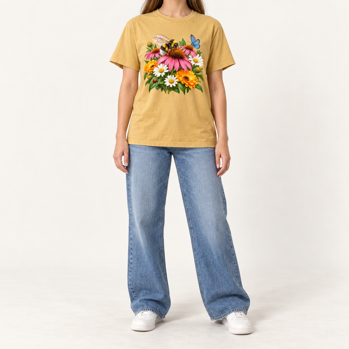 The Mustard Pollinator Garden tee worn, showing the bumblebee and coneflower print centered on the chest