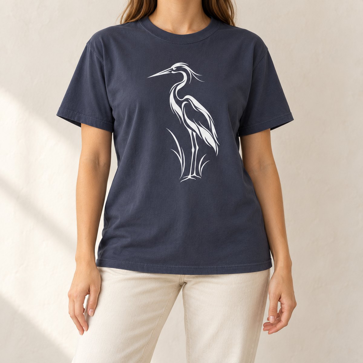 Flowing Great Blue Heron T-Shirt in Navy — white line-art heron on a garment-dyed Comfort Colors tee