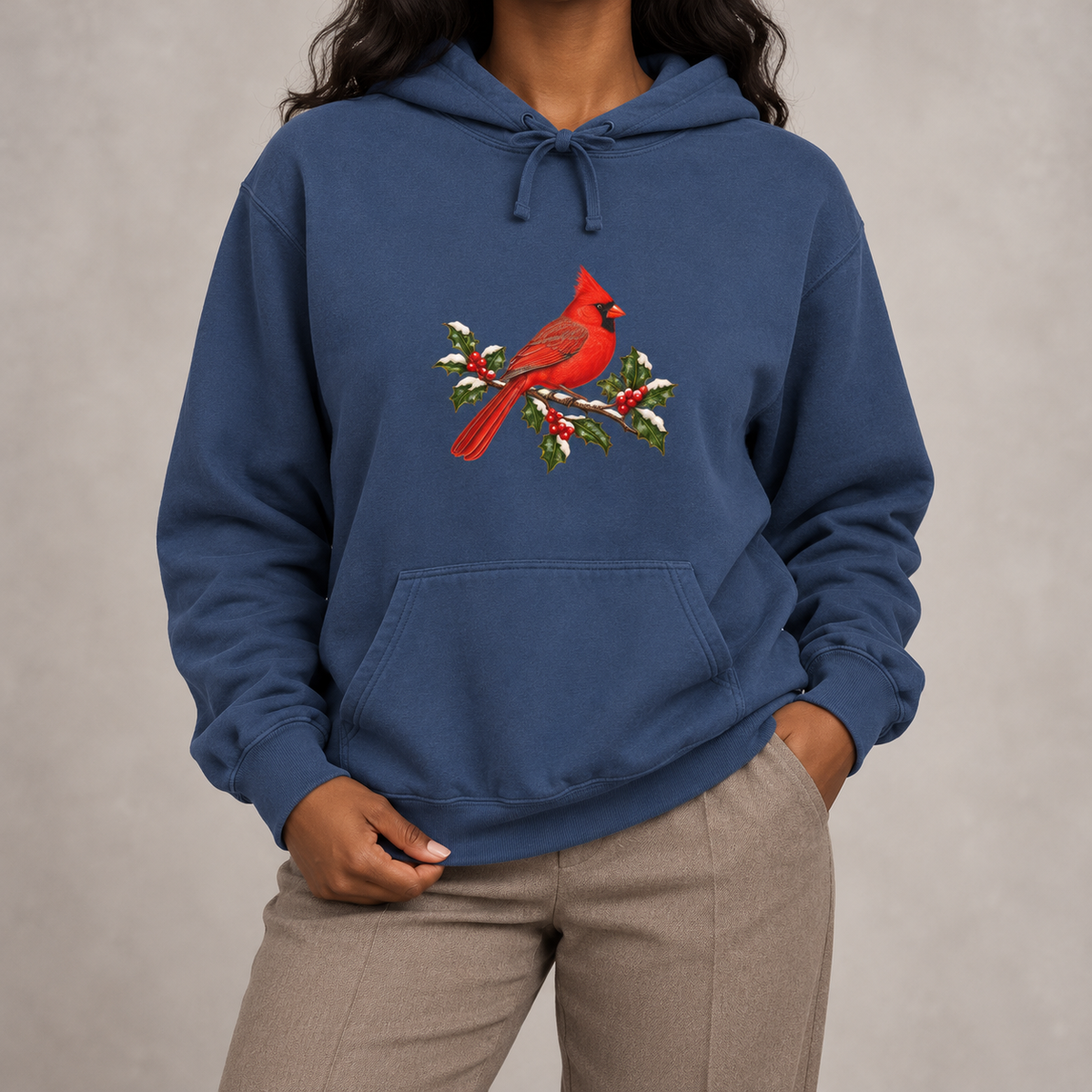 Winter Cardinal hoodie in True Navy worn, front view with the cardinal on snowy holly