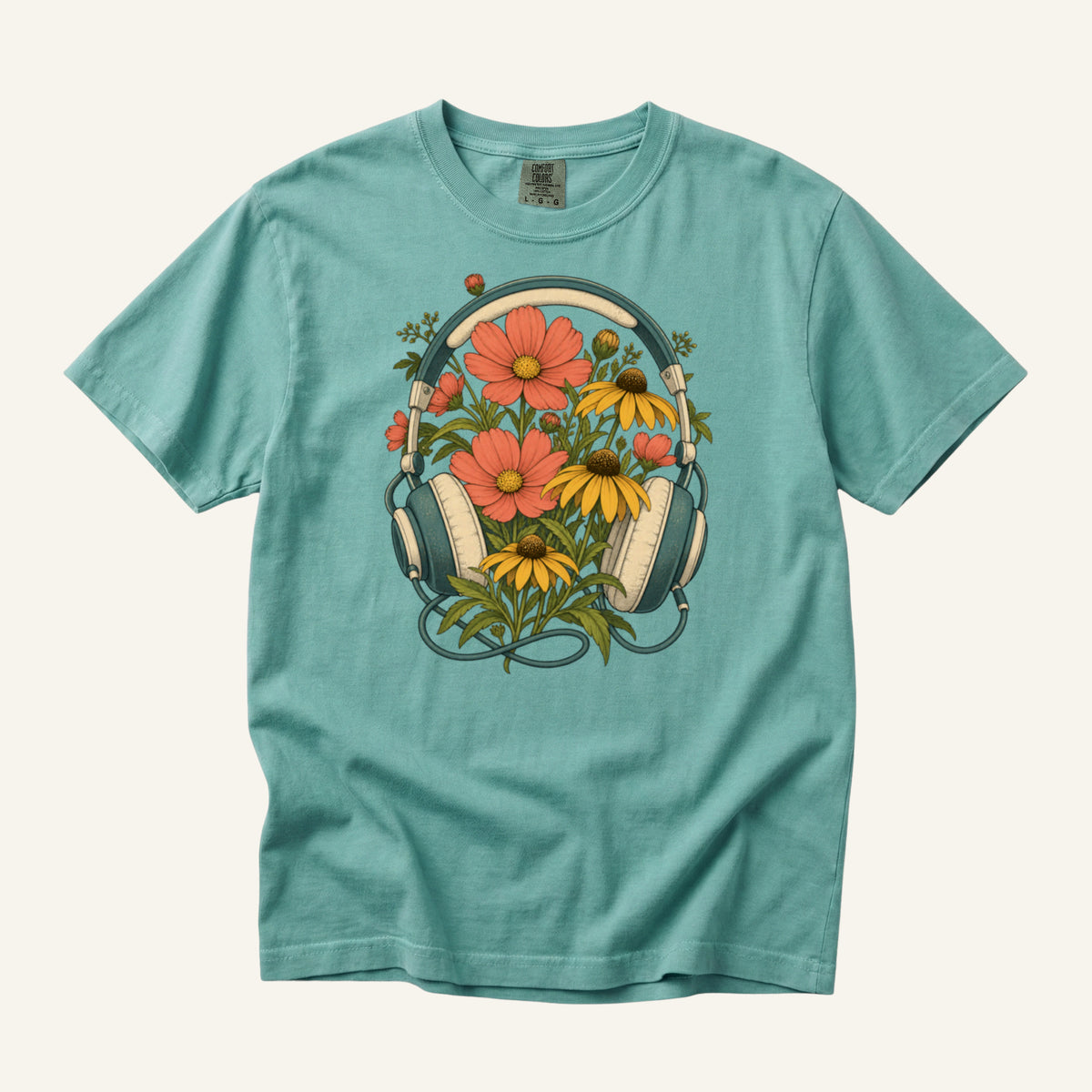 On Her Own Frequency T-Shirt in Chalky Mint — a fresh garden backdrop for the orange and yellow blooms