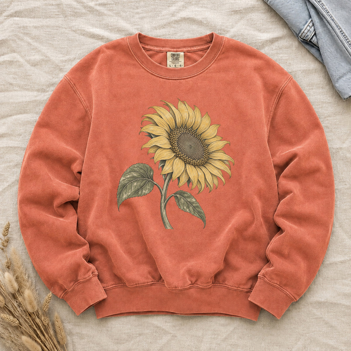 One Summer Taller sweatshirt in Terracotta, a golden sunflower botanical print on warm rust