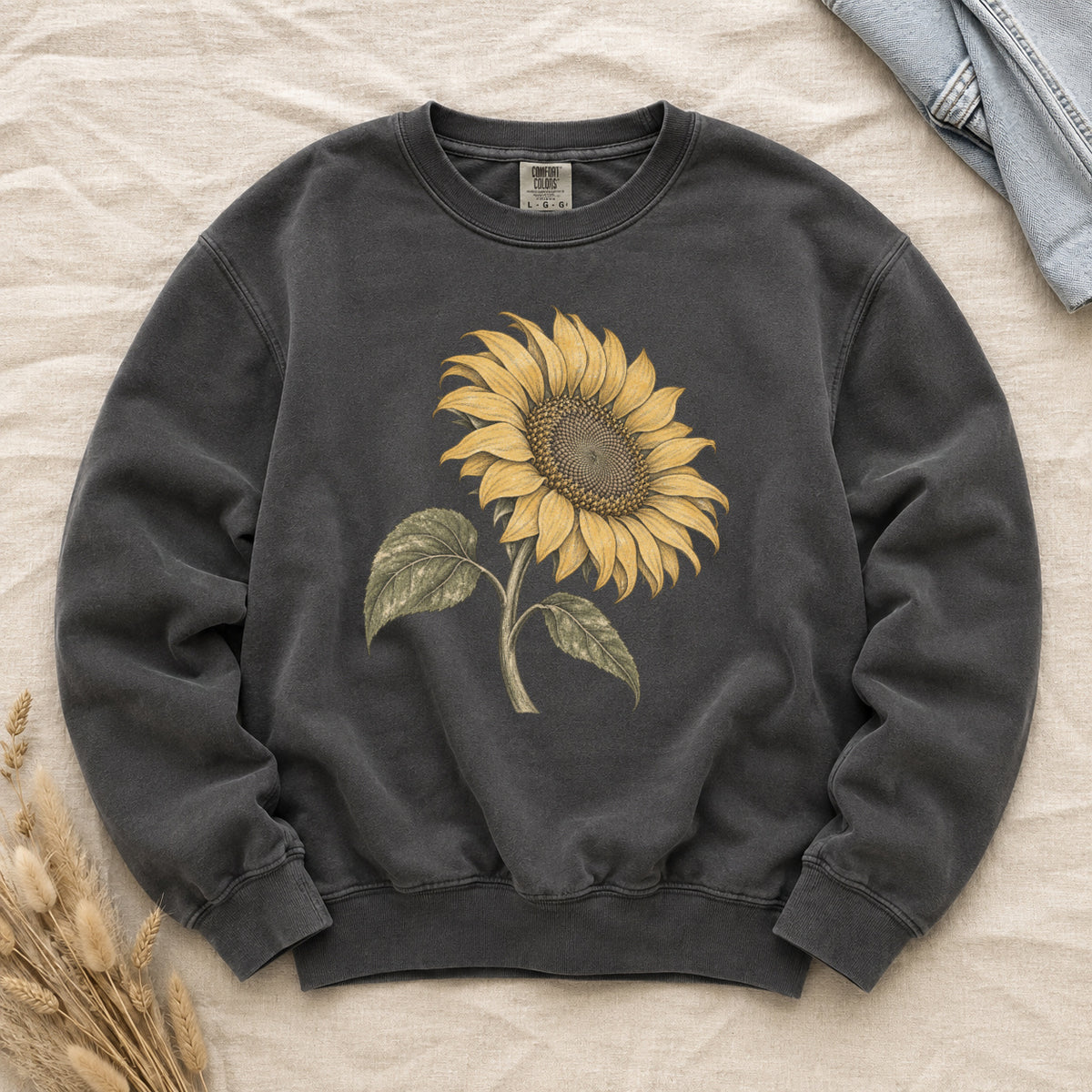 One Summer Taller sweatshirt in Pepper, a single golden sunflower drawn like a vintage botanical study