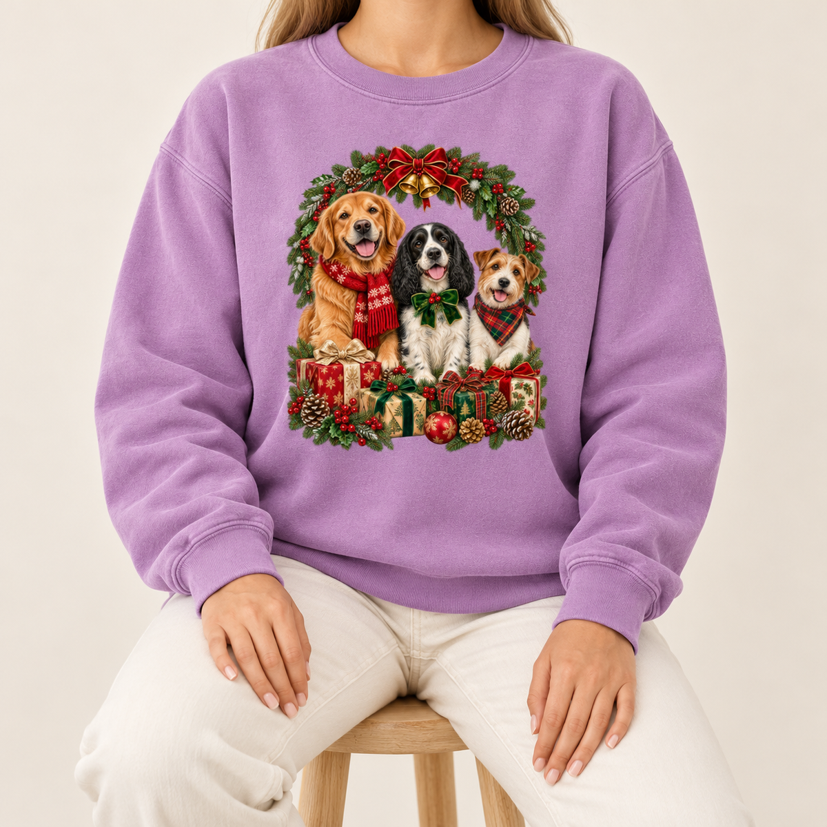 The three-dog Christmas wreath print shown on the Orchid garment-dyed Comfort Colors 1566 crewneck sweatshirt
