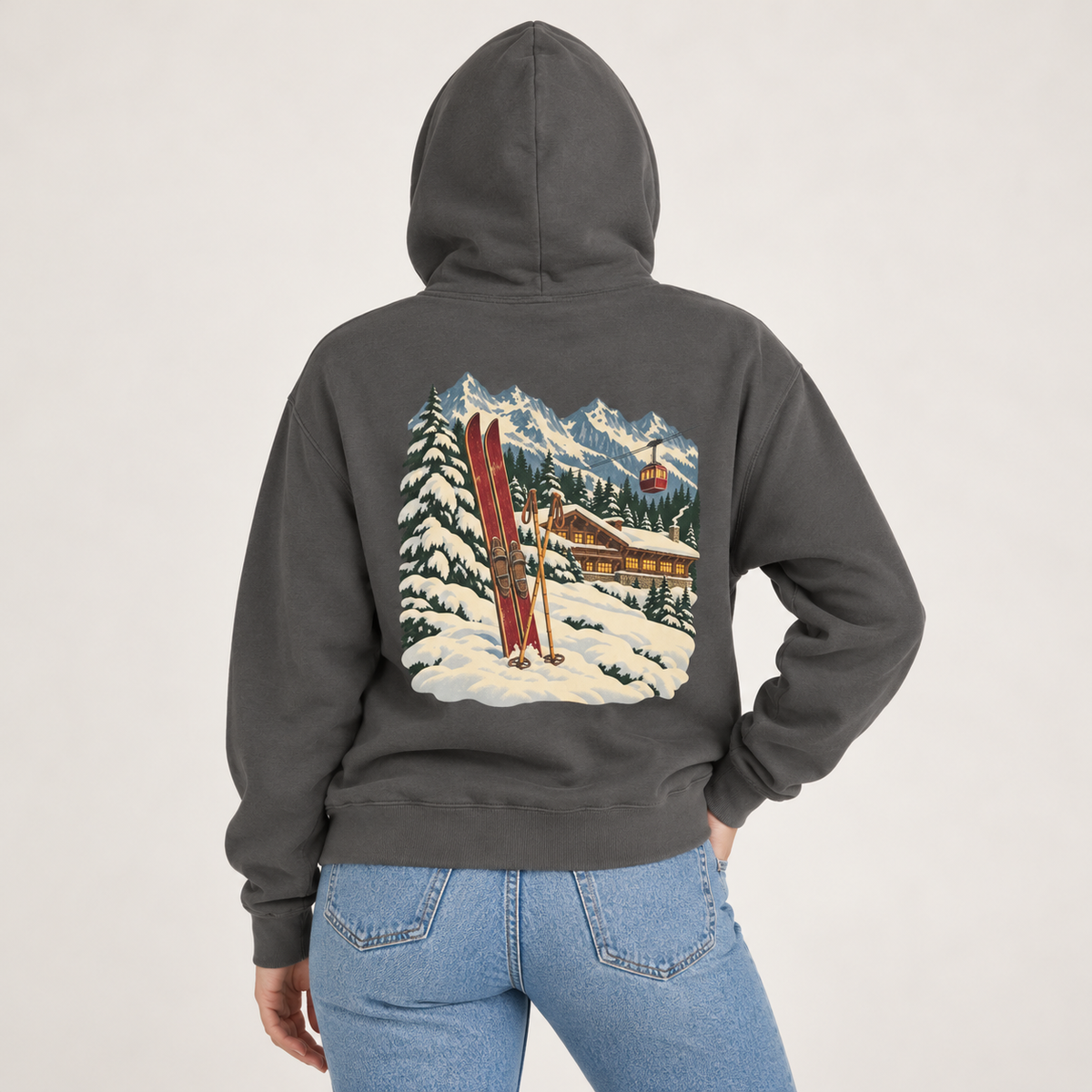 Vintage Ski Lodge hoodie in Pepper worn, back view with the lit chalet, gondola and mountain scene
