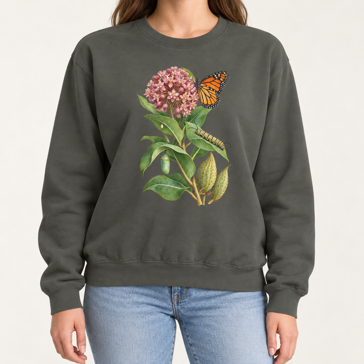 Milkweed and monarch life cycle sweatshirt in Pepper, botanical monarch butterfly print on a washed black Comfort Colors crewneck