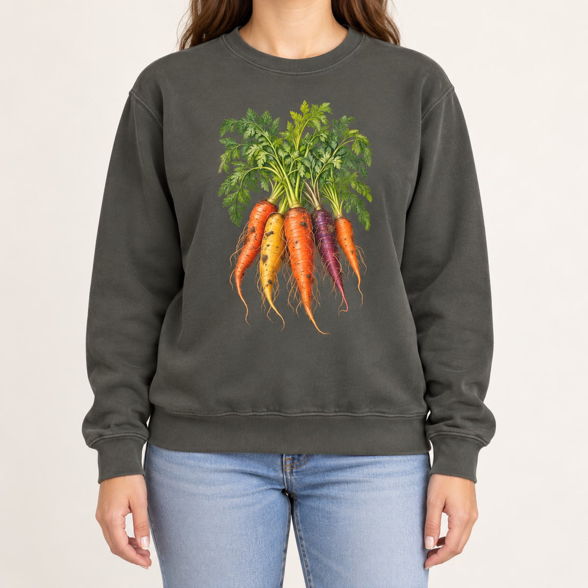 Heirloom carrot sweatshirt in Pepper – orange, gold and purple rainbow carrots with feathery green tops, printed large on the chest of a Comfort Colors crewneck