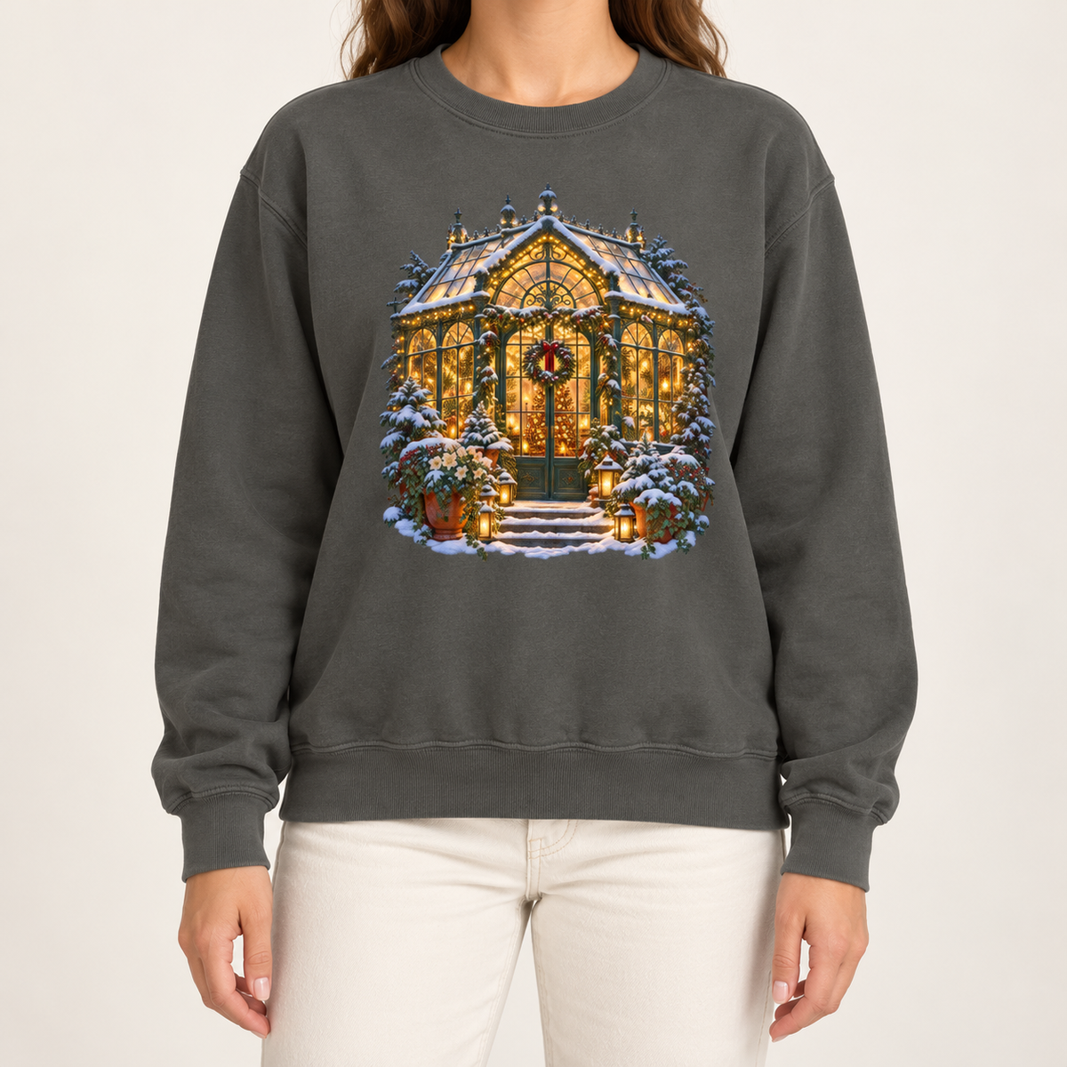 Christmas greenhouse sweatshirt in Pepper: a snowy Victorian conservatory glowing with warm lights on a deep charcoal garment-dyed Comfort Colors crewneck