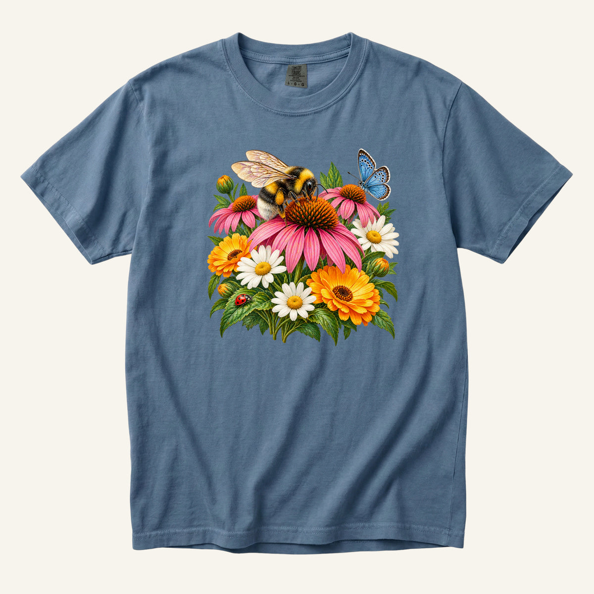 Pollinator Garden T-Shirt - a bumblebee on a pink coneflower with white daisies, orange blooms, a blue butterfly and a red ladybug, on a Blue Jean garment-dyed Comfort Colors tee