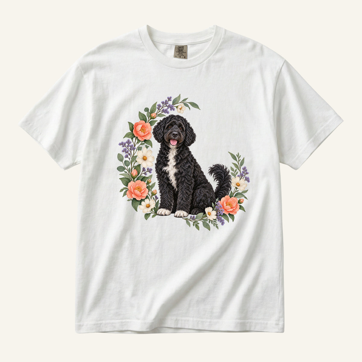 Portuguese Water Dog T-Shirt in White — a curly-coated Portuguese water dog among camellia blossoms
