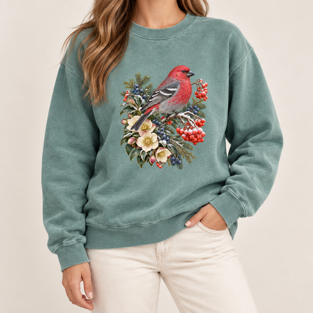 Red bird and winter botanicals graphic print on a heavyweight garment-dyed Comfort Colors 1566 crewneck — a bright red bird among evergreen sprigs, red and blue berries and cream flowers