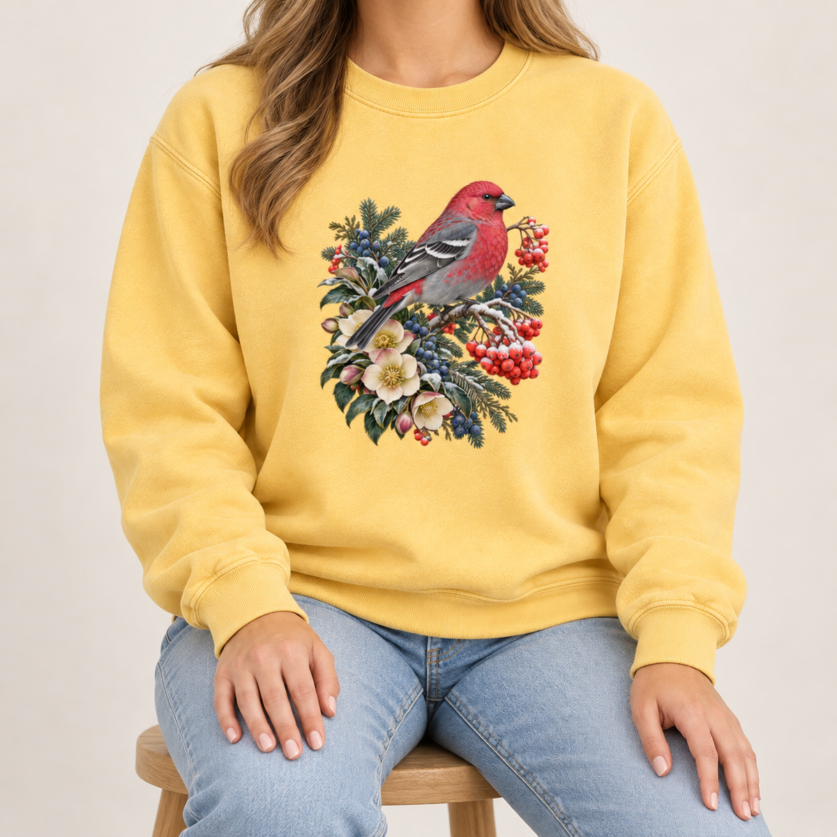 Red bird winter sweatshirt, relaxed unisex fit, adult sizes S to 3XL — a bright red bird among evergreen sprigs, red and blue berries and cream flowers