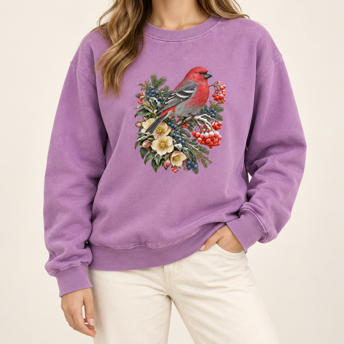 Red bird winter crewneck with 1x1 ribbed collar, cuffs and waistband — a bright red bird among evergreen sprigs, red and blue berries and cream flowers