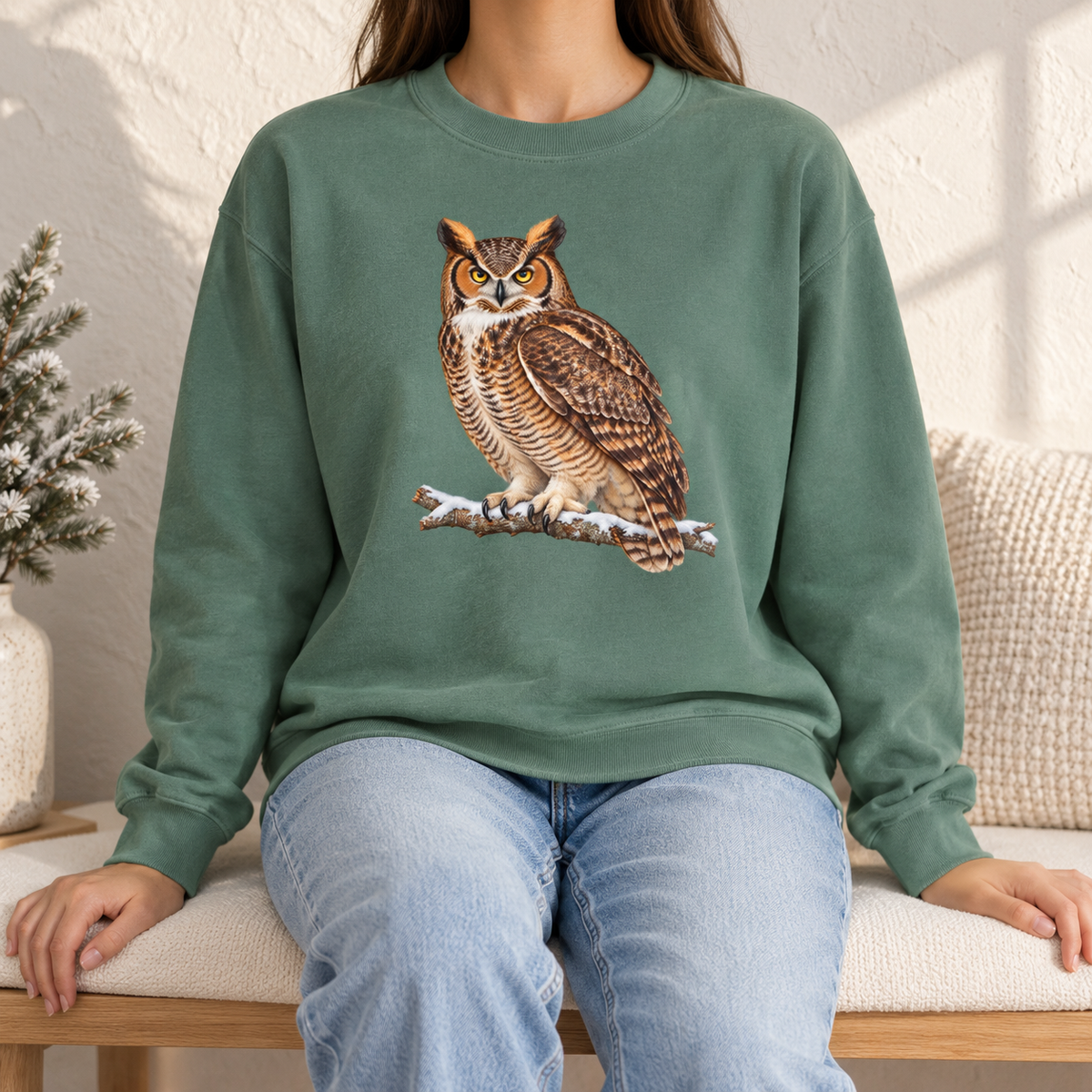Great horned owl sweatshirt in Light Green worn by a woman – the owl on a snowy branch on a soft sage Comfort Colors crewneck