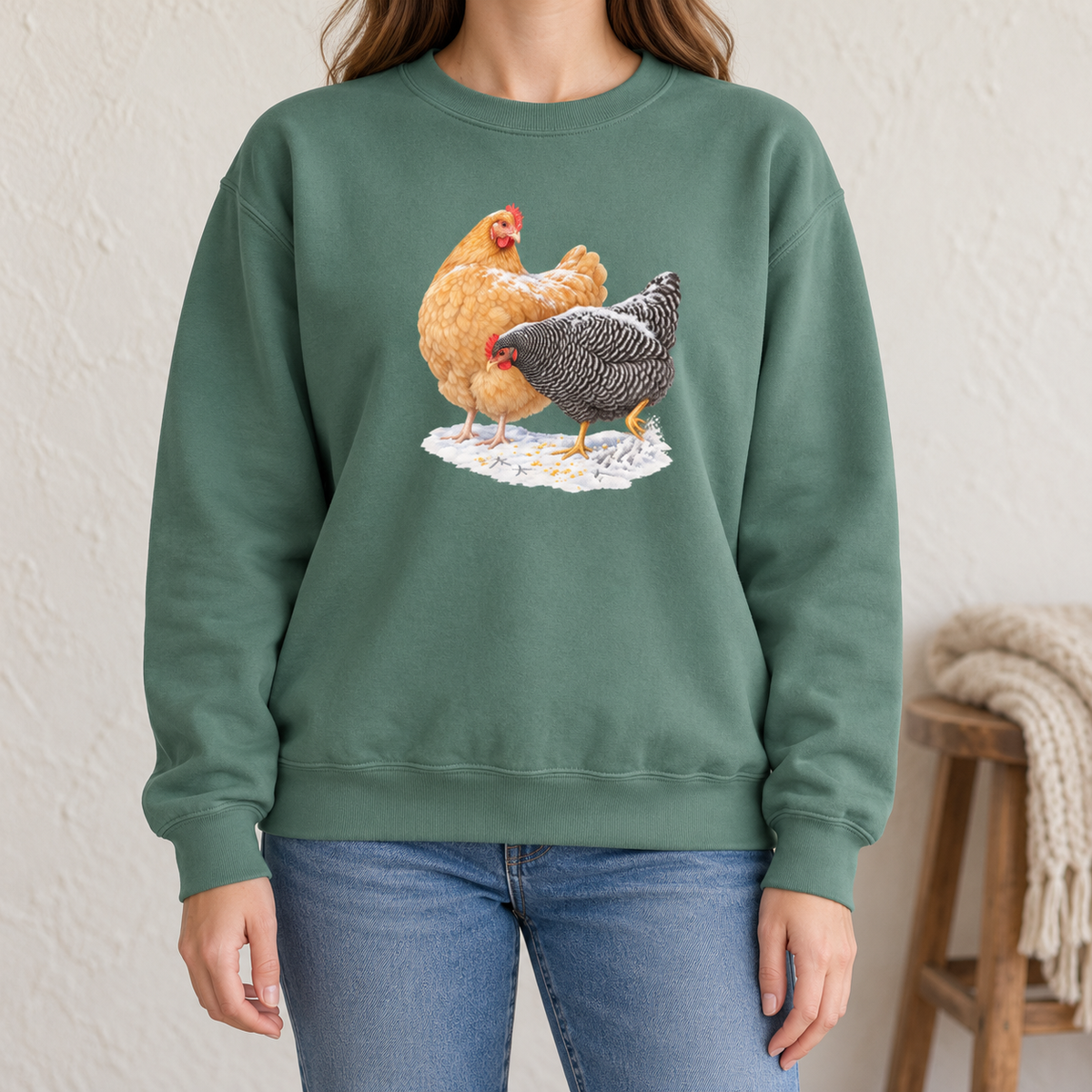 Winter hens sweatshirt in Light Green worn by a woman – Buff Orpington and Barred Rock in snow on a soft sage Comfort Colors crewneck