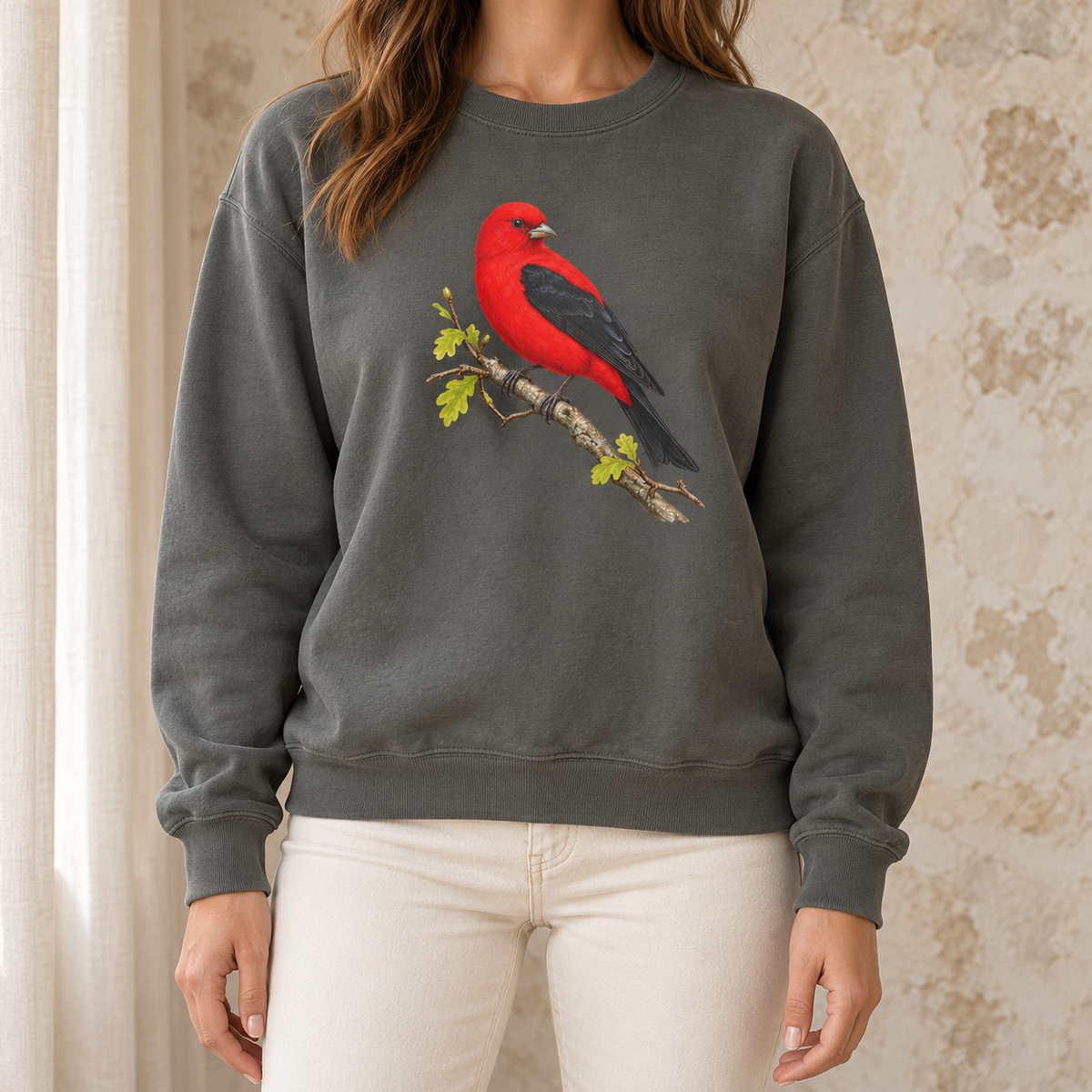 Scarlet Tanager sweatshirt in Pepper — red bird with black wings on a spring oak branch, garment-dyed Comfort Colors crewneck