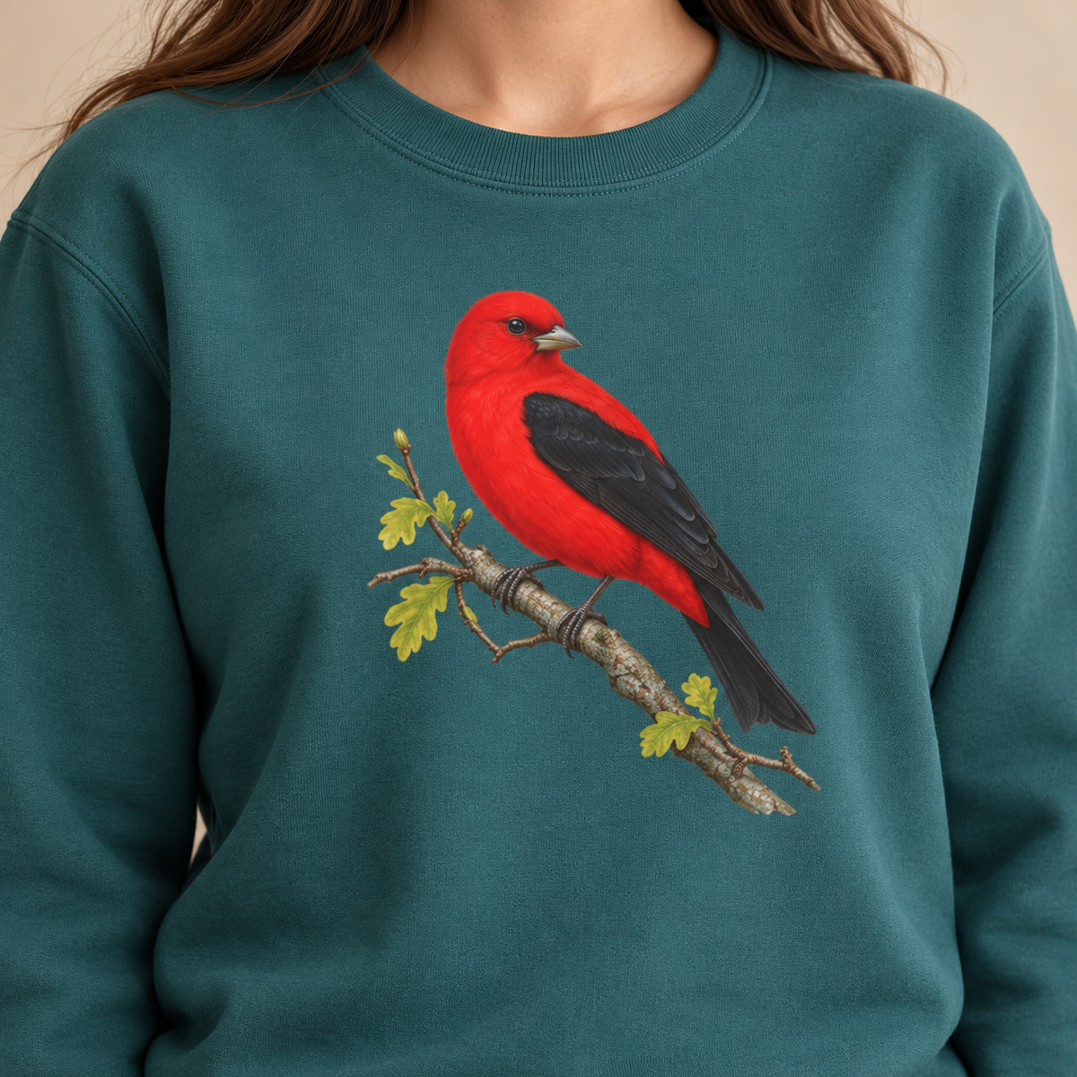 Scarlet Tanager sweatshirt in Blue Spruce, second view — red bird on a spring oak branch, garment-dyed Comfort Colors crewneck