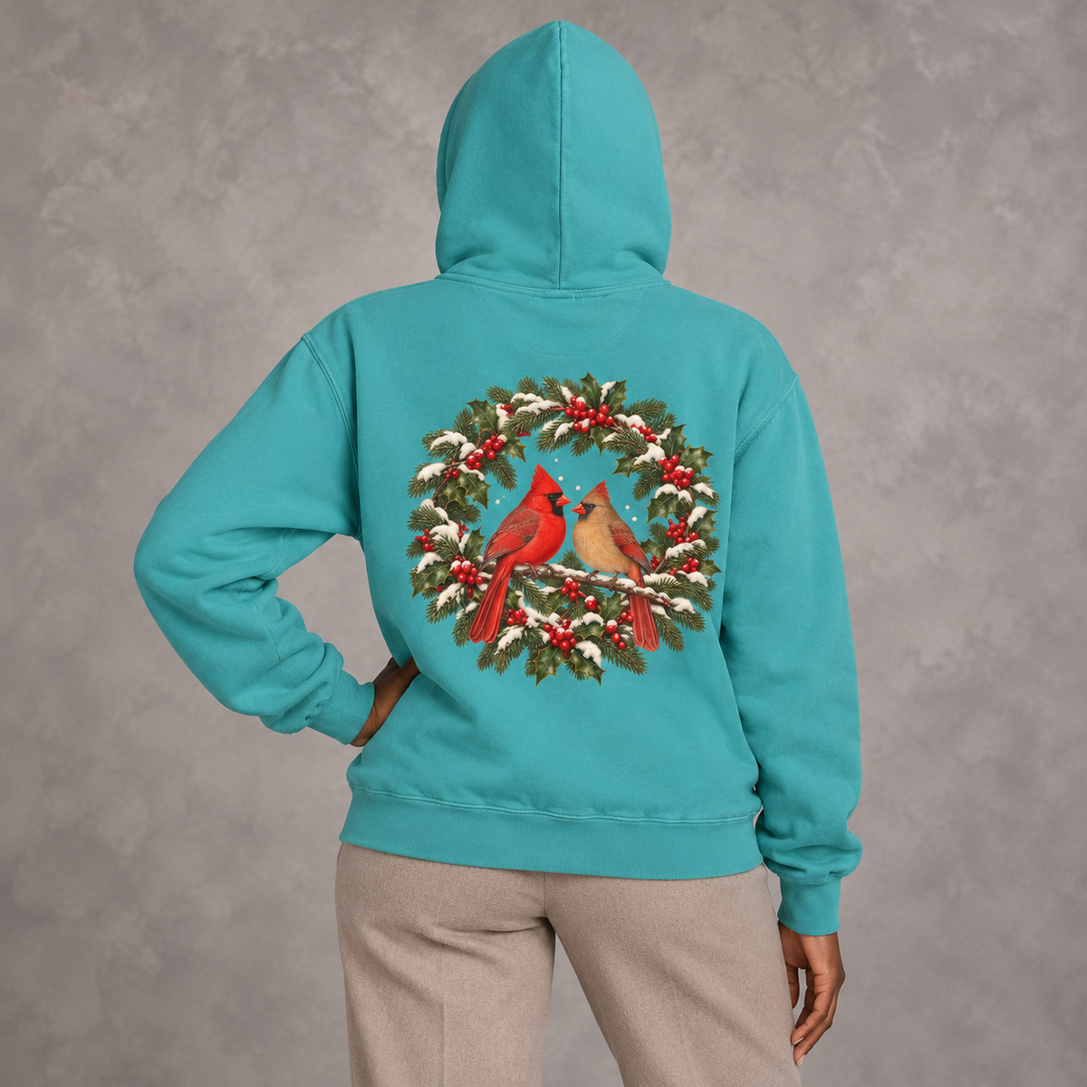 Winter Cardinal hoodie in Seafoam worn, back view with the cardinal wreath print