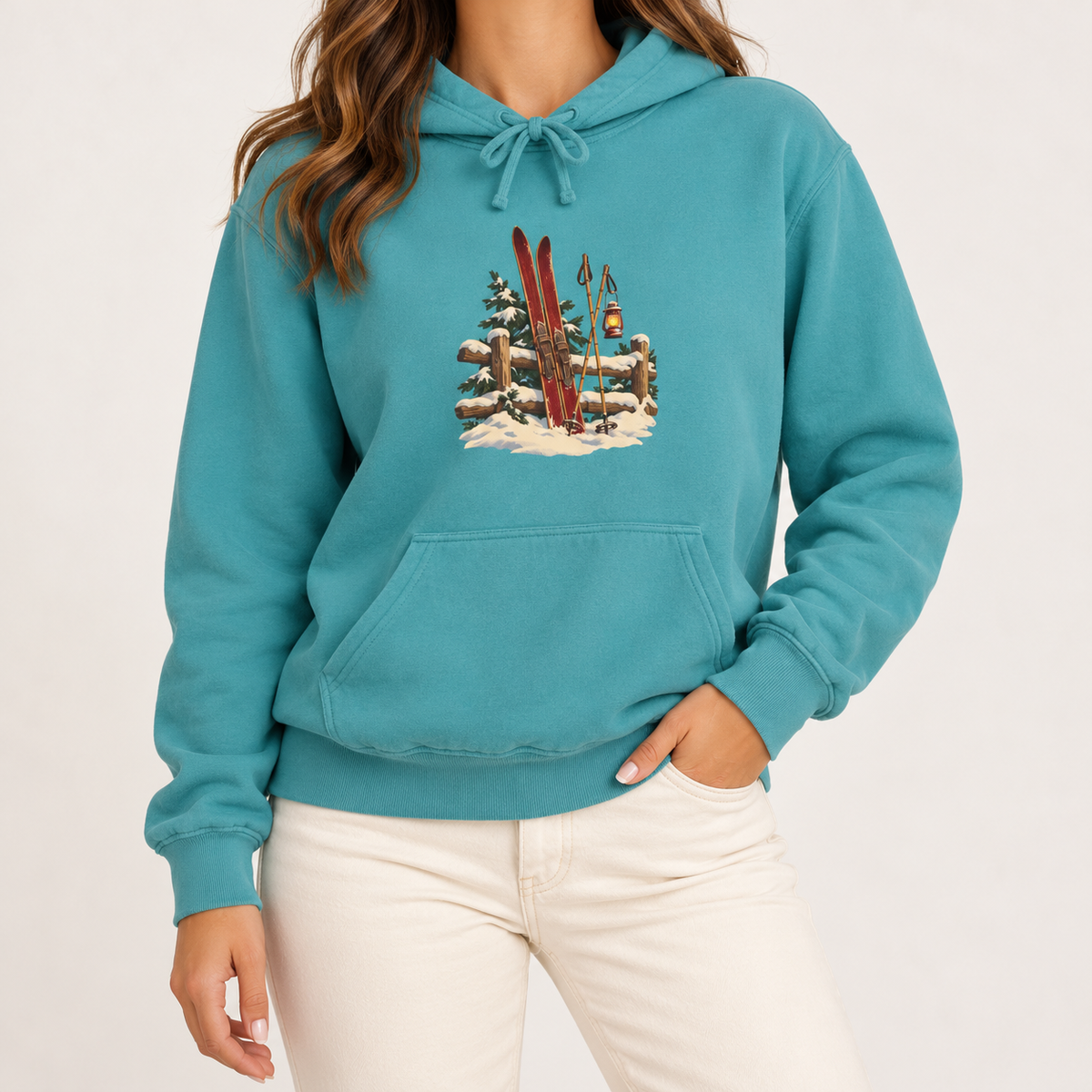 Vintage Ski Lodge hoodie in Seafoam worn, front view with the small skis-and-fence print
