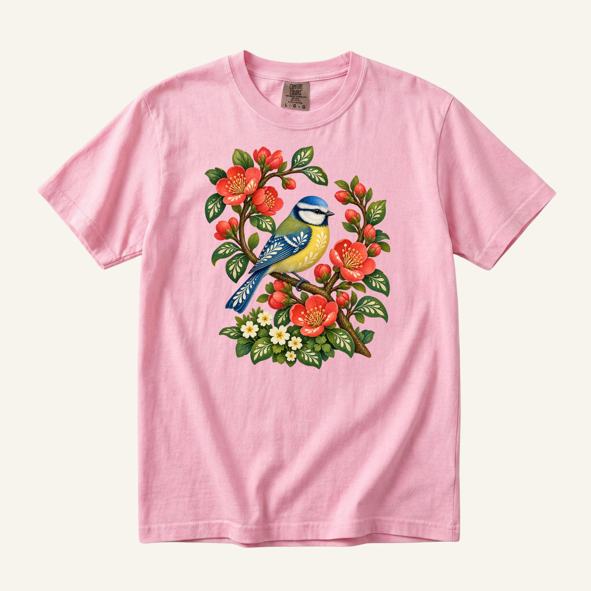 Folk Art Songbird & Red Blossom T-Shirt in Blossom — soft pink supporting the floral theme while the bird stays prominent