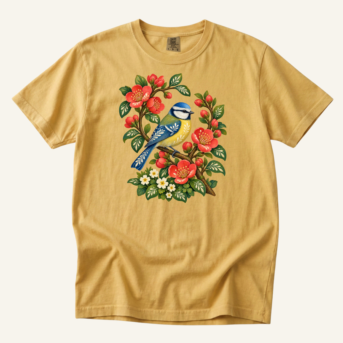 Folk Art Songbird & Red Blossom T-Shirt in Mustard — a warm gold echoing the bird's golden breast against its blue wings