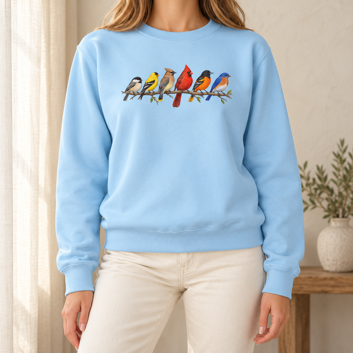 Colorful Birds on Branches sweatshirt in Chambray — six painted songbirds on one branch: chickadee, goldfinch, cedar waxwing, northern cardinal, Baltimore oriole and eastern bluebird, on a garment-dyed Comfort Colors crewneck