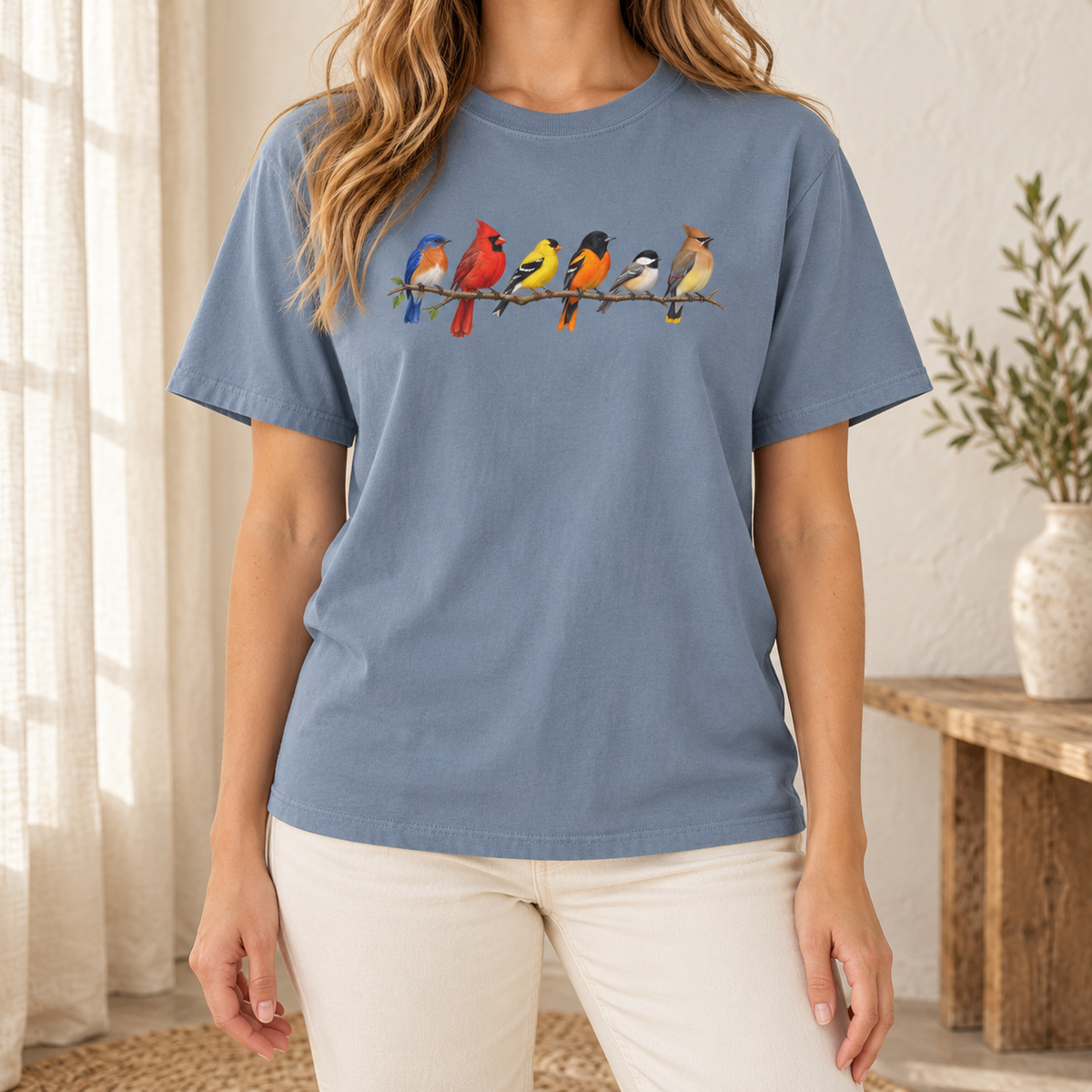 Colorful Birds on Branches t-shirt in Blue Jean — six painted songbirds on one branch: chickadee, goldfinch, cedar waxwing, northern cardinal, Baltimore oriole and eastern bluebird, on a garment-dyed Comfort Colors tee