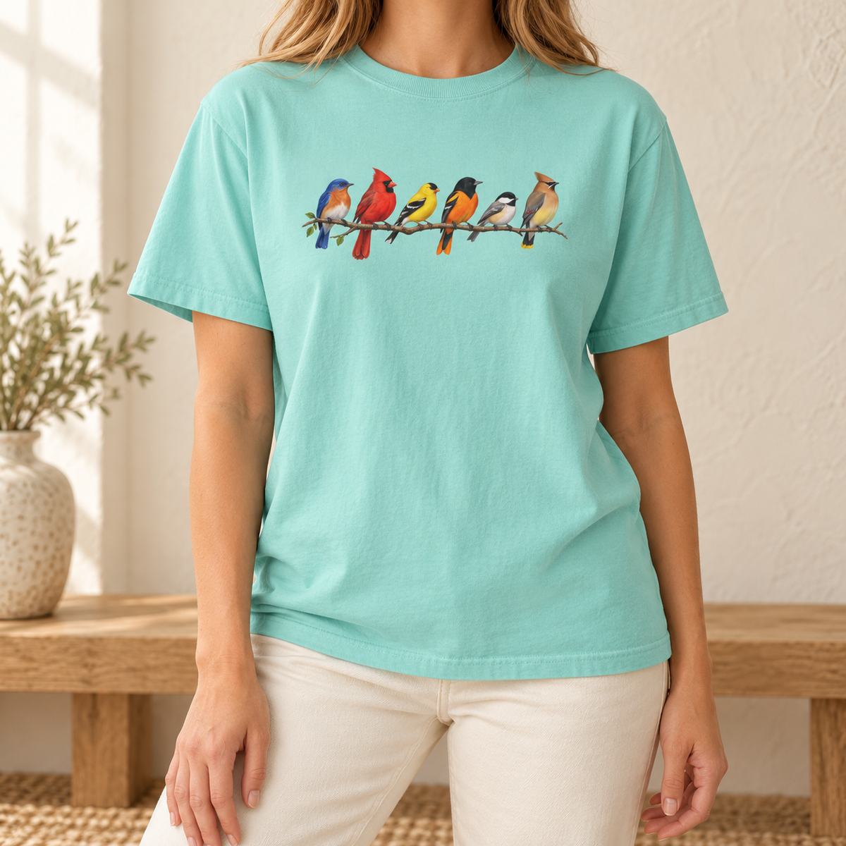 Colorful Birds on Branches t-shirt in Chalky Mint — six painted songbirds on one branch: chickadee, goldfinch, cedar waxwing, northern cardinal, Baltimore oriole and eastern bluebird, on a garment-dyed Comfort Colors tee